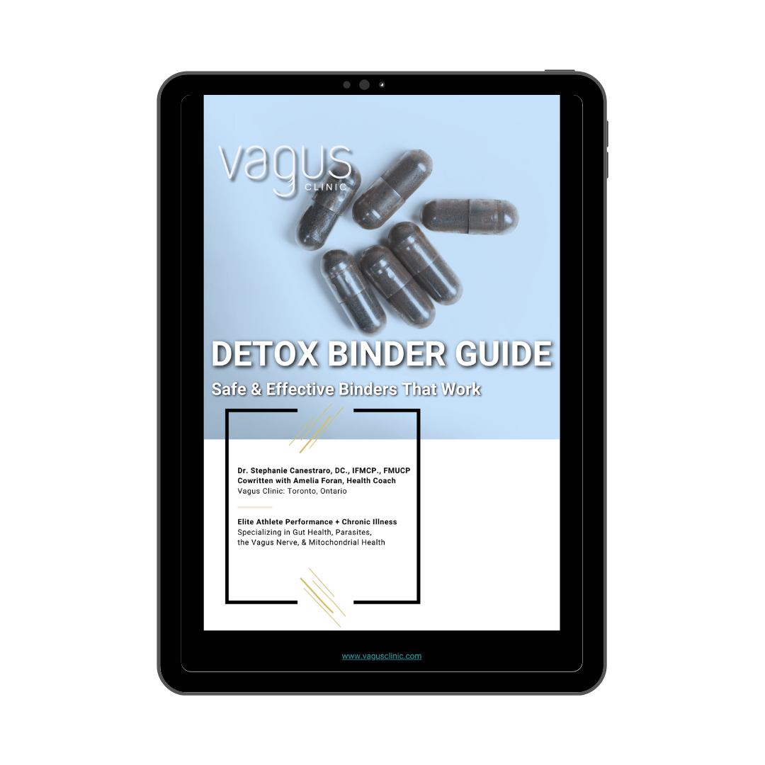 A digital tablet displaying the cover of the 'Detox Binder Guide', with text and a logo.