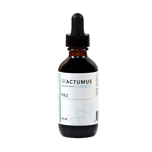 A bottle of Actumus PR2, a herbal product used for eliminating parasites, with a label indicating the brand and product name.