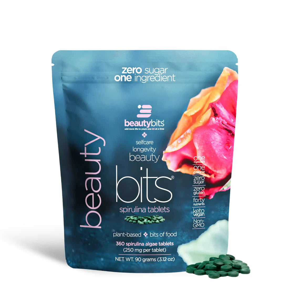 A small bag of BEAUTYbits Spirulina algae tablets, with a label showing the product name and a pink flower, indicating it is a plant-based beauty product.