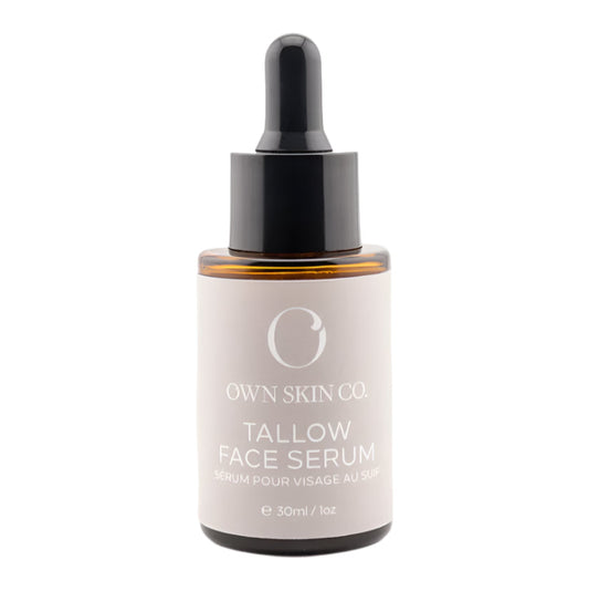 Tallow face serum bottle with dropper on a white background