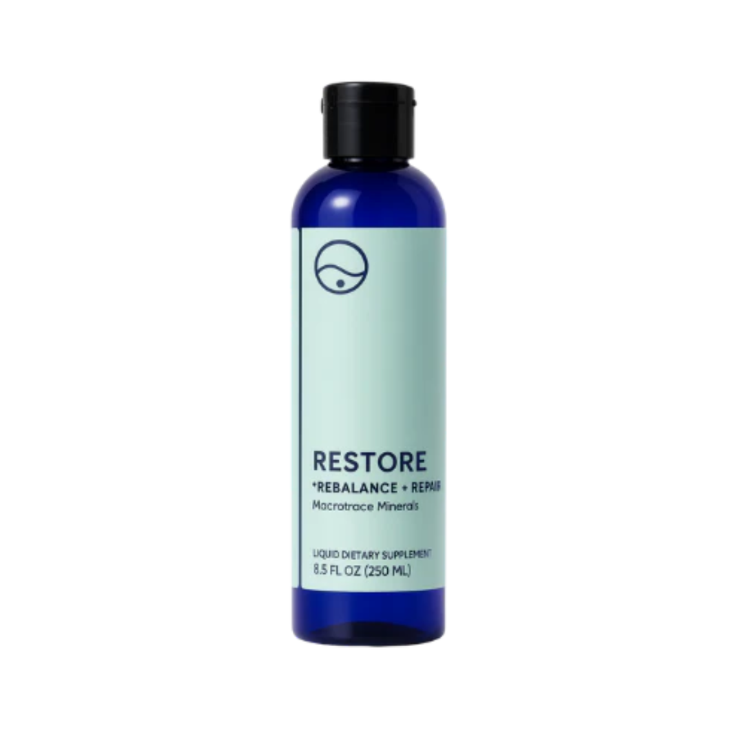 Bottle of 'Restore' supplement with blue label on a white background