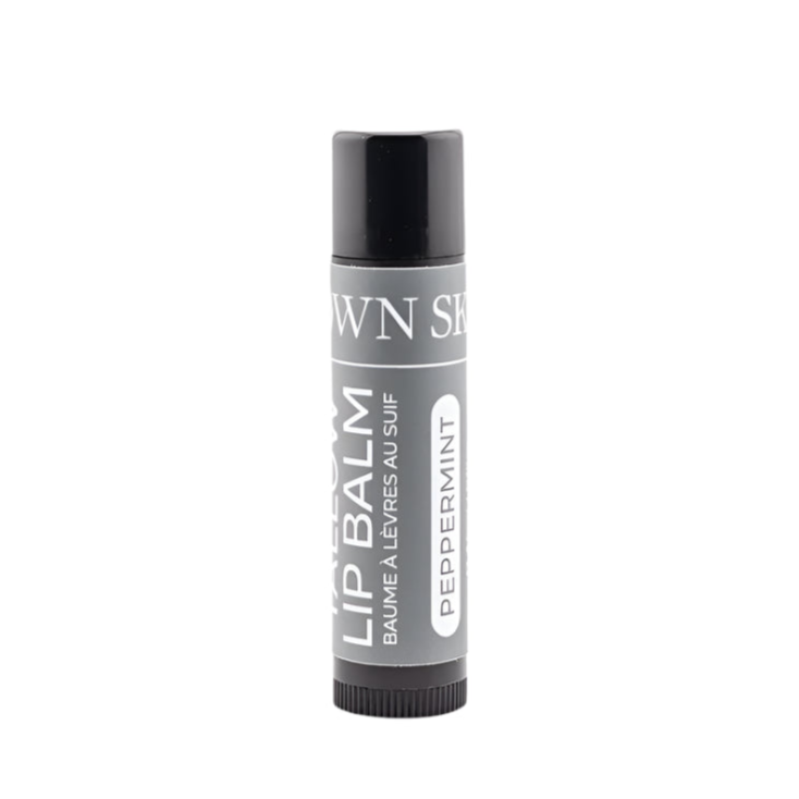 Lip balm container with 'Own Skin Co.' branding on a white background